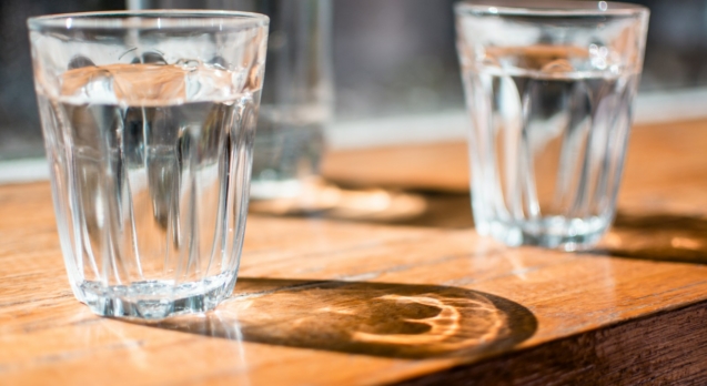 three clear drinking glass on table