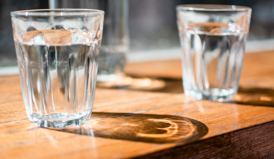 three clear drinking glass on table